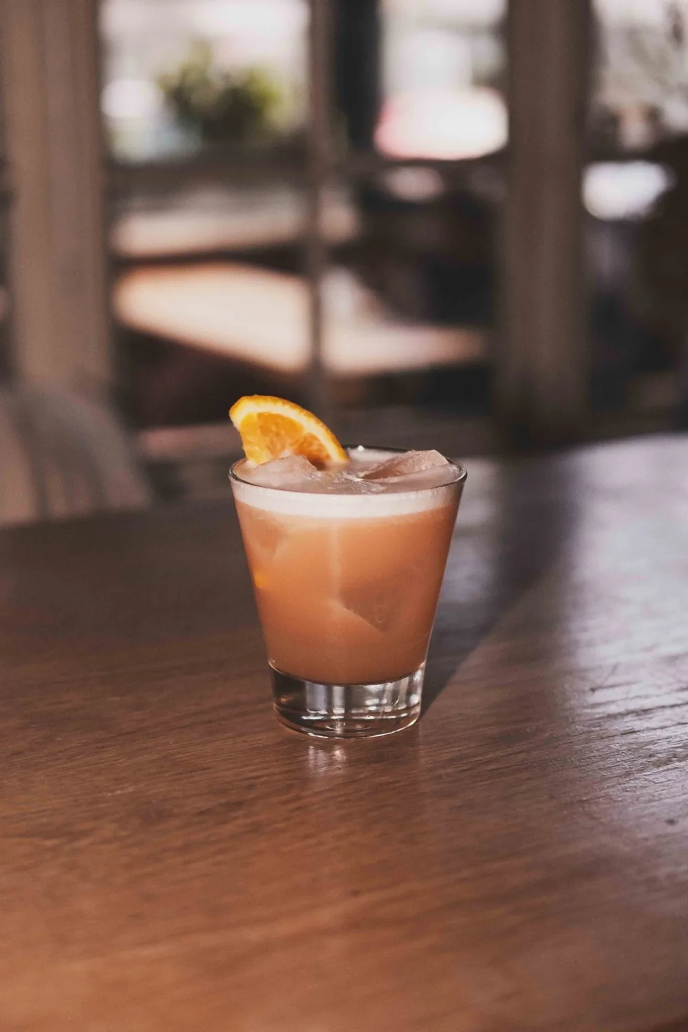 An orange cocktail served on The Gallimaufry bar